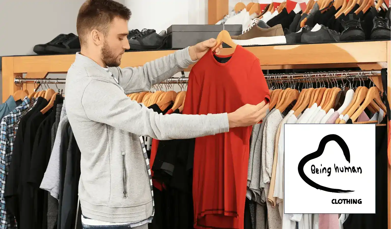 a man holding a red shirt