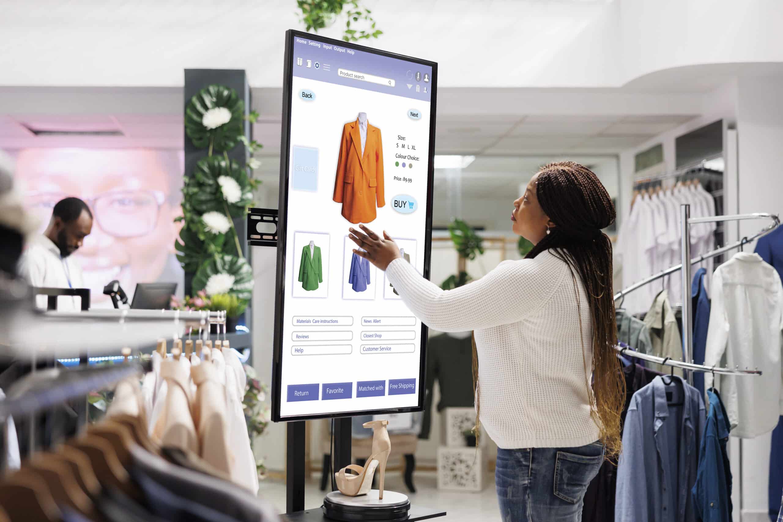 Woman buyer selecting clothes on board